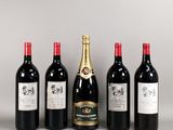 four bottles of wine are lined up on a table