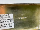 a metal container with a sticker on the side of it