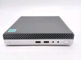 a close up of a small computer on a white surface