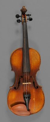 an old violin with a bow on a gray background