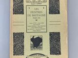 un vieux livre sur lequel figure l'image d'un chat