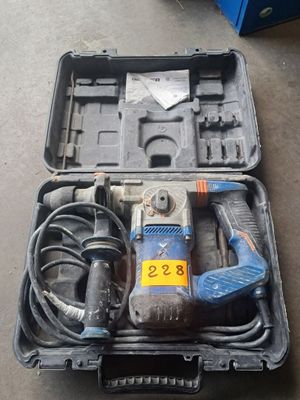 a tool in a case that is sitting on the floor