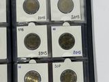 a lot of coins in a box on the table