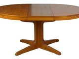 an image of a wooden table with four leaves on it