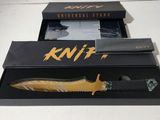 a knife that is in a box on a table