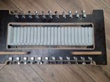 a very old musical instrument that is on the floor