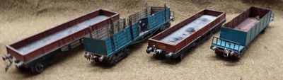 three toy trucks that are sitting on the ground