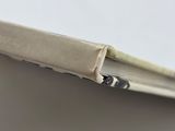 a close up of a piece of paper with a pen sticking out of it