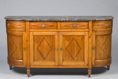 an antique sideboard with marble top