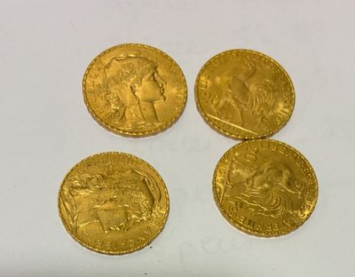 four gold sovereigns, one of which is a sovereign and one of which is a sovereign