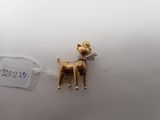 a small gold dog that is on a string