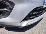 a close up of a car ' s front bumper with a number plate on it