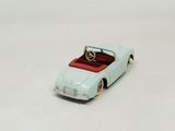 a toy car that is sitting on a white surface
