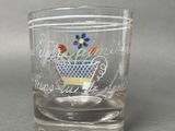 a glass with a tea cup on it on a table
