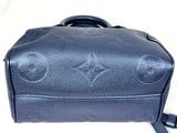 louis vuitton blue leather handbag with monograms on it