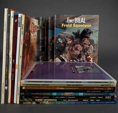 several books are stacked on top of each other on a table
