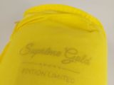 a close up of a yellow bag with writing on it