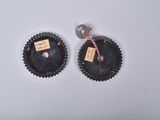 pair of black and gold cupcake tins with tags on them
