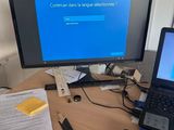 a laptop and a computer monitor on a desk