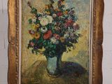 une peinture à l'huile représentant un vase de fleurs posé sur un chevalet