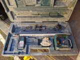 a tool case with tools inside of it on the ground