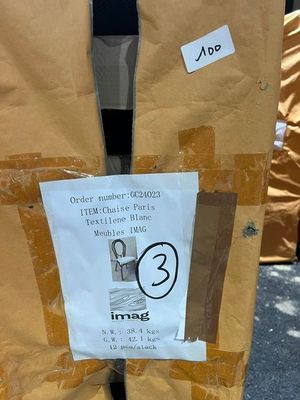 a cardboard bag that has a picture of a man on it