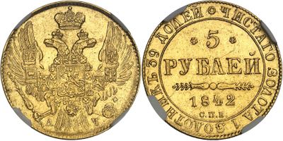 a gold coin with the image of a bird and a crown on it