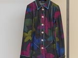 a picture of a jacket hanging on a clothes rack