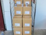 a cart full of boxes sitting on top of a cement floor