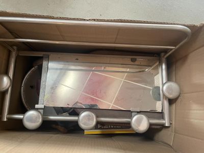 a box with a mirror inside of it on the floor