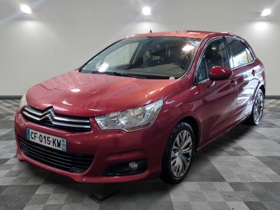 the red citrole is parked on a checkered floor