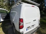 a white van that is parked next to a white van