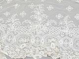 a close up of a piece of lace on a table