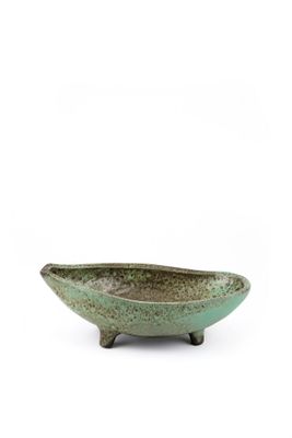 green ceramic bowl with legs on a white background