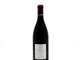 a bottle of wine that is sitting on a table