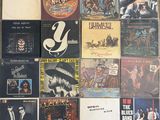 a lot of records on the wall of a room