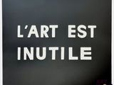 black and white photograph of a sign that says l ' art est nutile