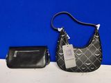 a black purse and a black purse with a tag on it