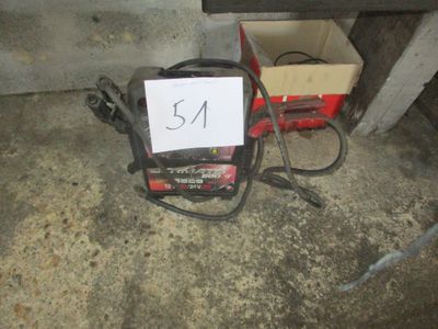 a picture of a small portable power source in a garage