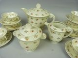 a group of tea and coffee cups and saucers