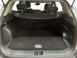 a trunk of a car with the back seats folded down