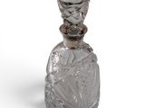 an image of a clear glass bottle with a silver stopper