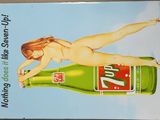tableau représentant une femme nue allongée sur une bouteille de soda