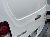 a white van that is parked next to a red fire hydrant
