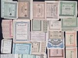 many different types of old and new paper money on a black surface