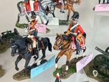 many figurines of soldiers on display in a glass case
