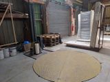 a picture of a warehouse with a lot of boxes and pallets