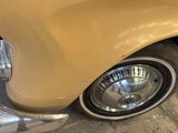 a close up of a car ' s front wheel and tire