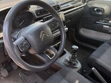a picture of a car with a steering wheel and dashboard