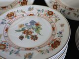 many plates that are stacked on top of each other